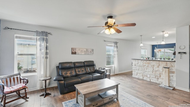 760 Guna, New Braunfels, TX 78130 - living room featuring wood finished floors, ceiling fan, and baseboards