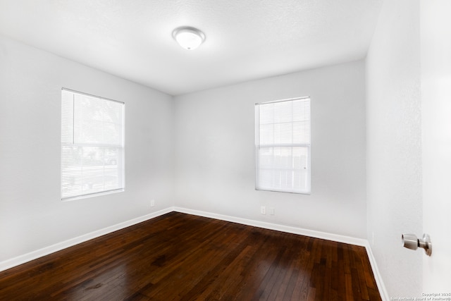 114 Oxford, San Antonio, TX 78213 - unfurnished room with baseboards and dark wood-style floors