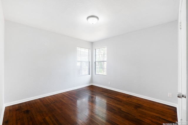 114 Oxford, San Antonio, TX 78213 - empty room featuring baseboards and dark wood-type flooring