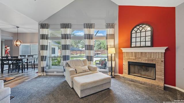 14534 Gunter Ave, San Antonio, TX 78254 - living room featuring baseboards, a fireplace, healthy amount of natural light, carpet, and high vaulted ceiling