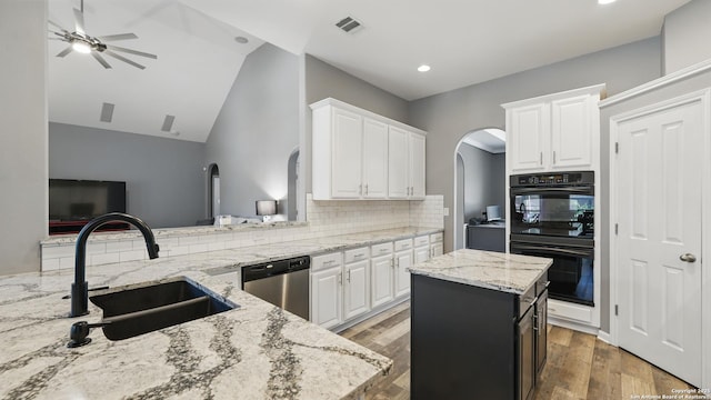 14534 Gunter Ave, San Antonio, TX 78254 - kitchen featuring dishwasher, a sink, ceiling fan, backsplash, and arched walkways