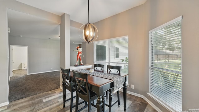 14534 Gunter Ave, San Antonio, TX 78254 - dining room with a chandelier, wood finished floors, and baseboards
