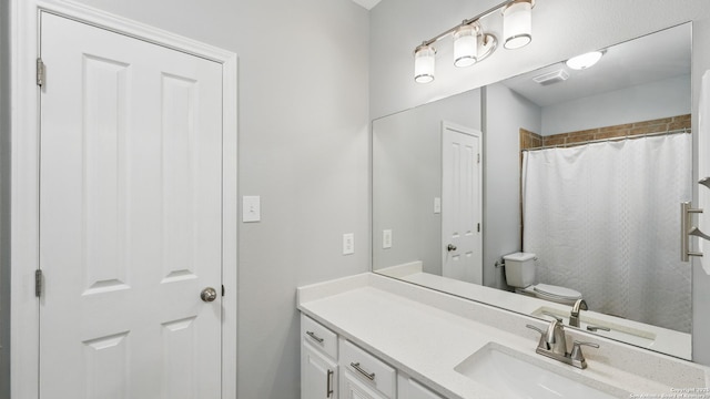 14534 Gunter Ave, San Antonio, TX 78254 - bathroom featuring vanity, toilet, and curtained shower