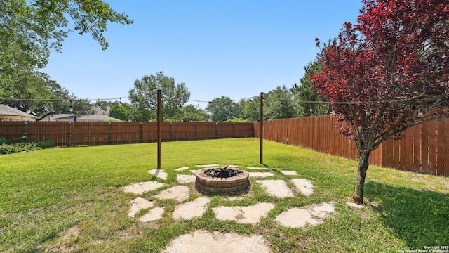 14534 Gunter Ave, San Antonio, TX 78254 - view of yard featuring a fire pit