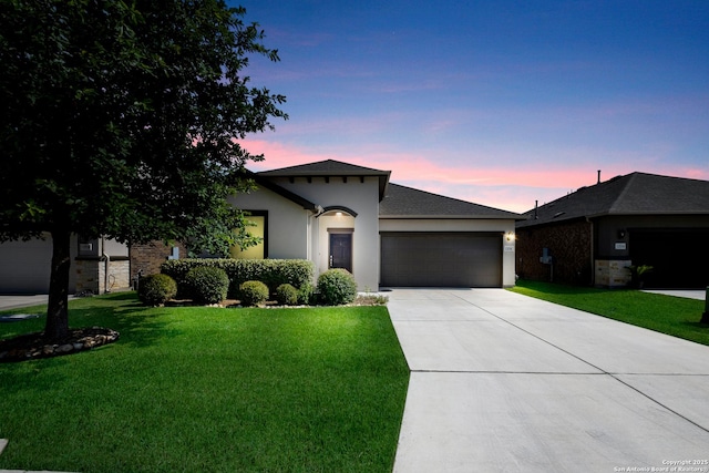 12530 Big Valley Crk, San Antonio, TX 78254 - ranch-style house featuring an attached garage, concrete driveway, a front yard, and stucco siding