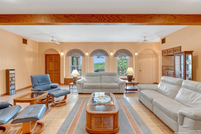 3619 Running Spgs, San Antonio, TX 78261 - living room with arched walkways, ceiling fan, light tile patterned floors, and beamed ceiling