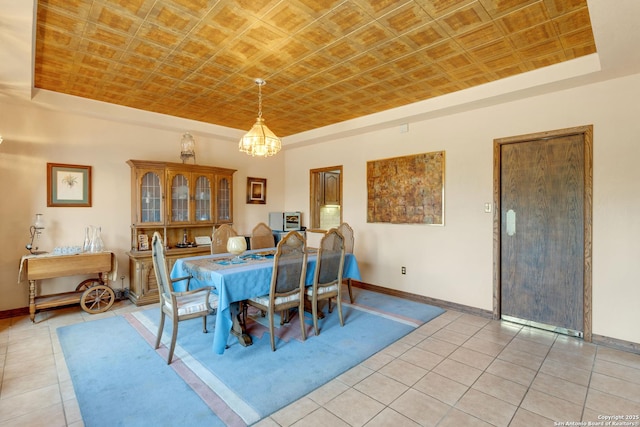 3619 Running Spgs, San Antonio, TX 78261 - dining space with a raised ceiling, baseboards, and light tile patterned floors