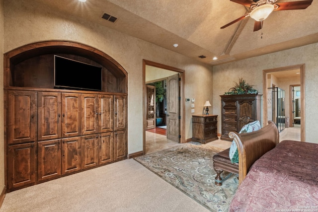 44 Oakland, Boerne, TX 78006 - bedroom featuring a textured wall, lofted ceiling, light carpet, ceiling fan, and recessed lighting