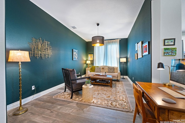 1235 Yaupon, New Braunfels, TX 78132 - living area featuring wood finished floors and baseboards