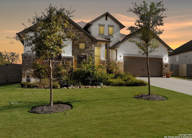 1235 Yaupon, New Braunfels, TX 78132 - view of front of house featuring stone siding, a front yard, and an attached garage