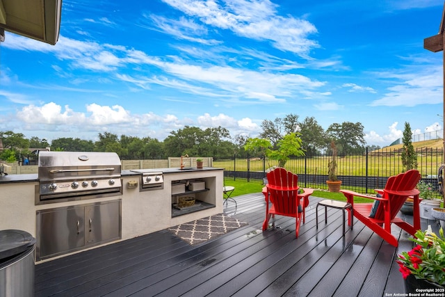 1235 Yaupon, New Braunfels, TX 78132 - wooden deck with a grill, a fenced backyard, and exterior kitchen