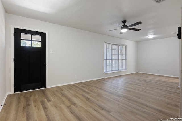 1102 Fillmore Dr, San Antonio, TX 78245 - foyer with light wood-style flooring, ceiling fan, and baseboards