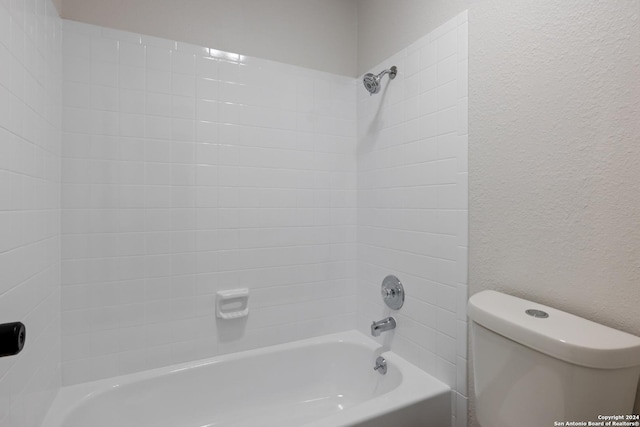 1102 Fillmore Dr, San Antonio, TX 78245 - full bathroom featuring a textured wall, bathtub / shower combination, and toilet