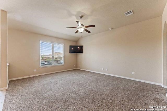 2317 Broken Wheel Ln, New Braunfels, TX 78130 - spare room with a ceiling fan, carpet flooring, baseboards, and a textured ceiling