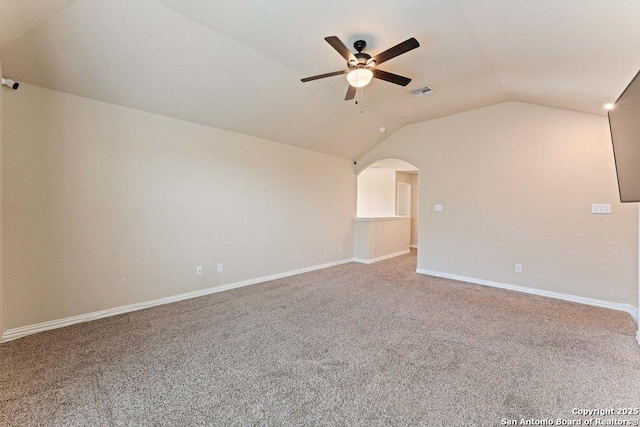 2317 Broken Wheel Ln, New Braunfels, TX 78130 - unfurnished room with vaulted ceiling, a ceiling fan, carpet floors, baseboards, and arched walkways