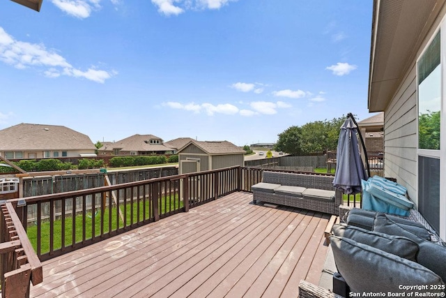 2317 Broken Wheel Ln, New Braunfels, TX 78130 - deck with a storage unit, a fenced backyard, an outbuilding, and a residential view