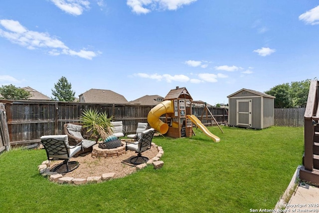 2317 Broken Wheel Ln, New Braunfels, TX 78130 - view of yard featuring a fire pit, a storage shed, a playground, and an outbuilding