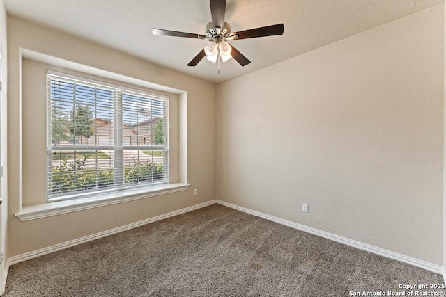 2317 Broken Wheel Ln, New Braunfels, TX 78130 - spare room featuring carpet, baseboards, and ceiling fan