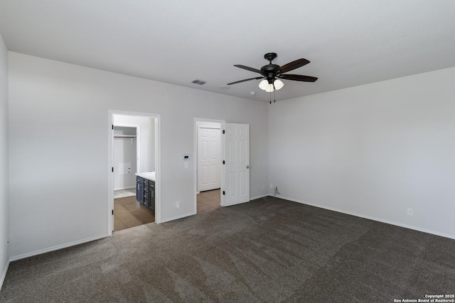 175 Katherine Way, San Antonio, TX 78253 - unfurnished bedroom featuring carpet flooring, baseboards, tile patterned flooring, ensuite bath, and a ceiling fan