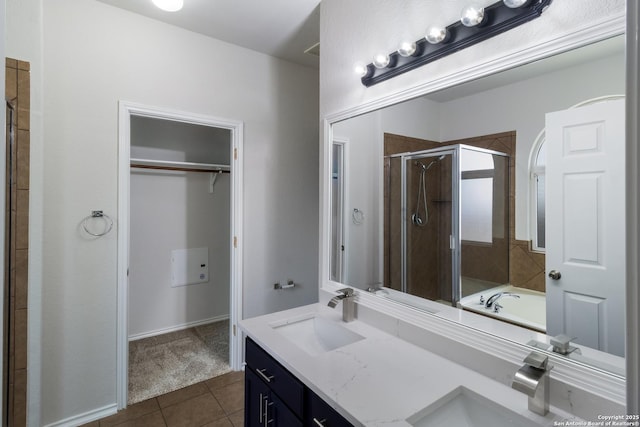 175 Katherine Way, San Antonio, TX 78253 - bathroom featuring a stall shower, tile patterned flooring, a spacious closet, and double vanity