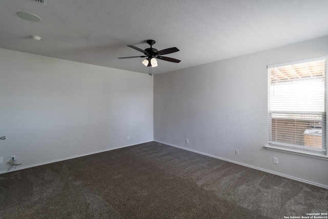 175 Katherine Way, San Antonio, TX 78253 - unfurnished room featuring dark colored carpet, a ceiling fan, baseboards, a smoke detector, and a textured ceiling