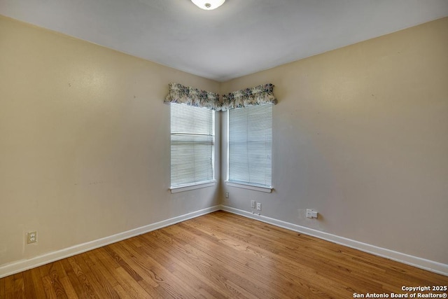 338 Tango Dr, San Antonio, TX 78216 - spare room with baseboards and wood finished floors