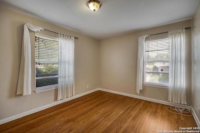338 Tango Dr, San Antonio, TX 78216 - unfurnished room with wood finished floors and baseboards