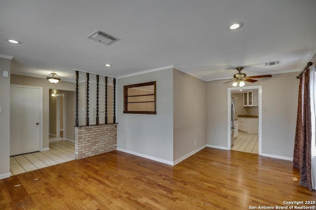 338 Tango Dr, San Antonio, TX 78216 - empty room with crown molding, light wood-style flooring, a ceiling fan, baseboards, and recessed lighting