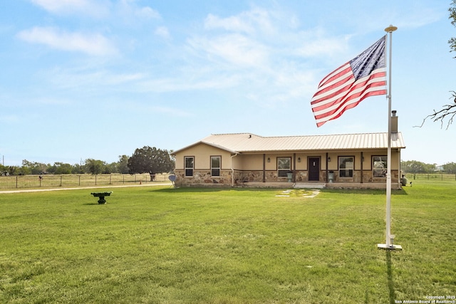 381 Schneider Rd, Seguin, TX 78155 - rear view of house with stucco siding, stone siding, and metal roof