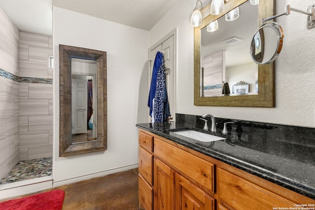 381 Schneider Rd, Seguin, TX 78155 - full bathroom with vanity, finished concrete floors, and tiled shower