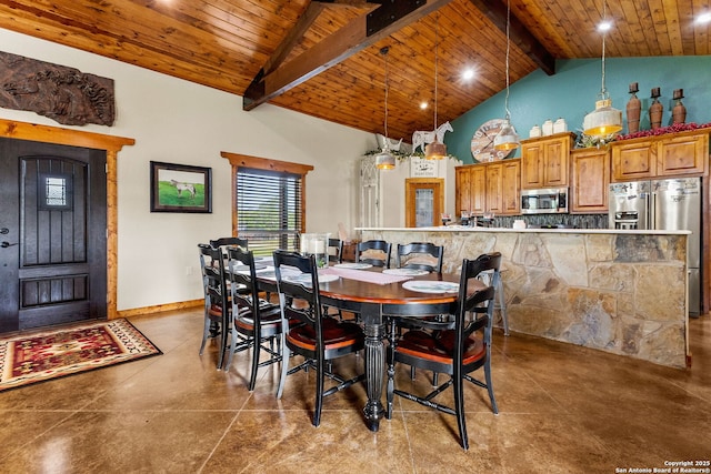 381 Schneider Rd, Seguin, TX 78155 - dining area with wooden ceiling, beamed ceiling, concrete flooring, high vaulted ceiling, and baseboards