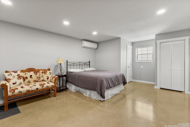 381 Schneider Rd, Seguin, TX 78155 - bedroom with a wall unit AC, baseboards, recessed lighting, and finished concrete floors