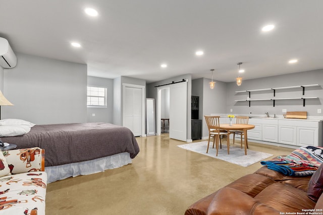 381 Schneider Rd, Seguin, TX 78155 - bedroom featuring a barn door, recessed lighting, concrete flooring, an AC wall unit, and bar