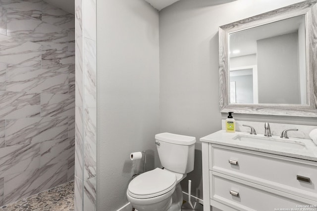 381 Schneider Rd, Seguin, TX 78155 - full bathroom with toilet, a tile shower, and vanity