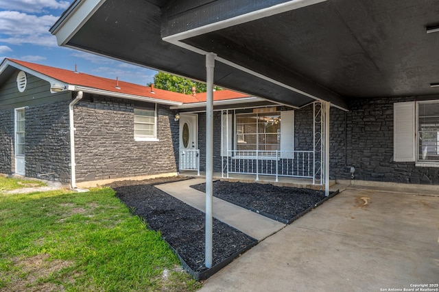 7626 Westfield, San Antonio, TX 78227 - view of exterior entry featuring stone siding and covered porch