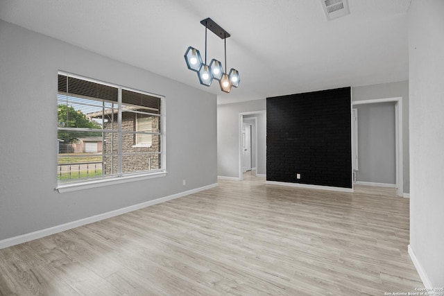 7626 Westfield, San Antonio, TX 78227 - empty room with a chandelier, light wood-style floors, and baseboards