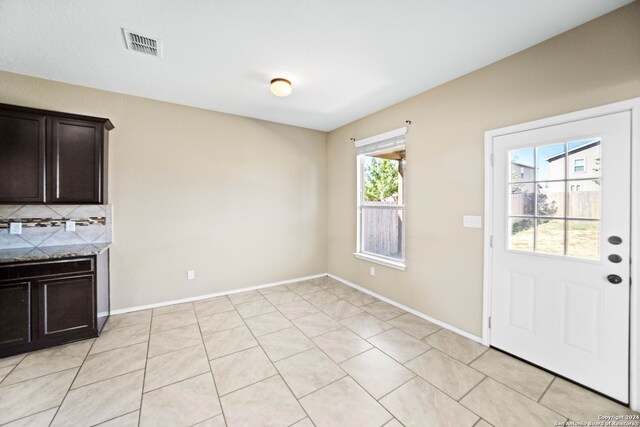 445 Auburn Park, Schertz, TX 78154 - unfurnished dining area featuring baseboards and light tile patterned floors