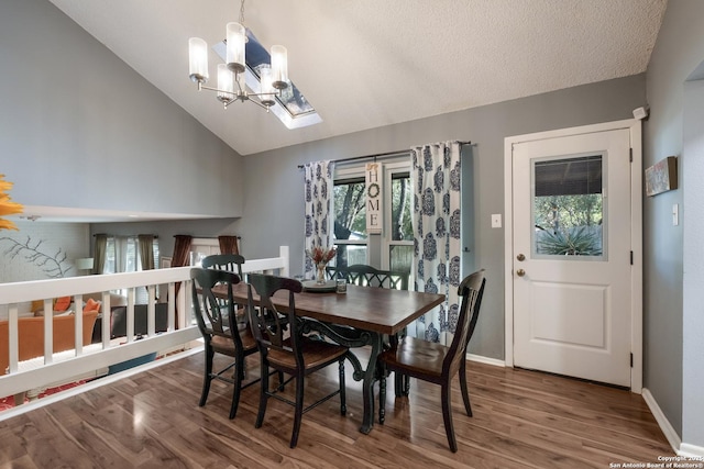 2930 Low Oak St, San Antonio, TX 78232 - dining room with a chandelier, vaulted ceiling, wood finished floors, and baseboards