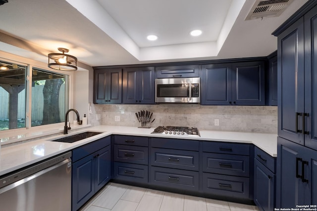 2930 Low Oak St, San Antonio, TX 78232 - kitchen with stainless steel appliances, a sink, decorative backsplash, light countertops, and recessed lighting