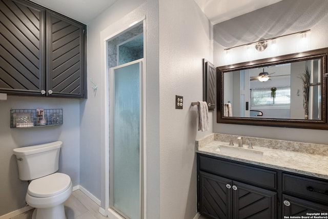 2930 Low Oak St, San Antonio, TX 78232 - full bathroom featuring a stall shower, toilet, vanity, and baseboards