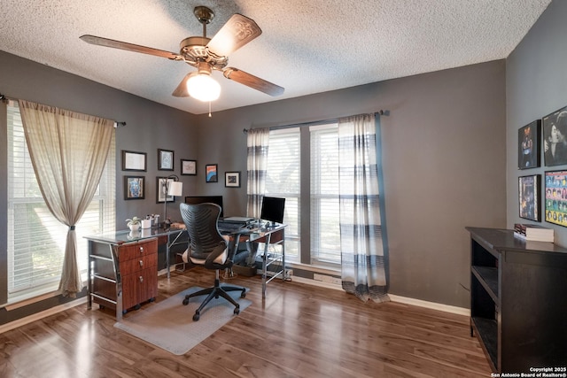 2930 Low Oak St, San Antonio, TX 78232 - office space with a textured ceiling, baseboards, wood finished floors, and a ceiling fan
