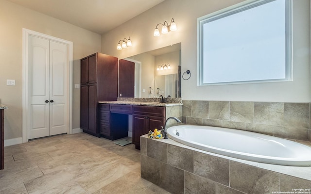 22793 N Cranes Mill Rd, Canyon Lake, TX 78133 - bathroom featuring a garden tub and vanity