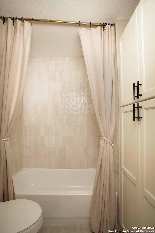 12006 Vista Nogal Unit 3A, San Antonio, TX 78213 - bathroom featuring shower / bath combo and toilet