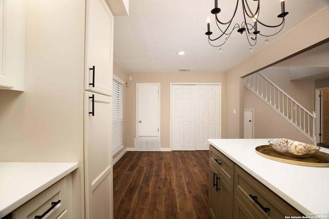 12006 Vista Nogal Unit 3A, San Antonio, TX 78213 - kitchen featuring dark wood-type flooring, light countertops, recessed lighting, baseboards, and a chandelier