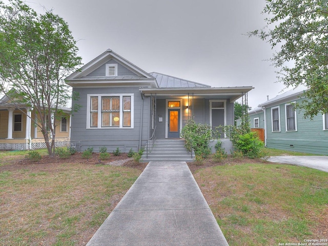 302 Cedar, San Antonio, TX 78210 - view of front of house featuring a porch, a standing seam roof, metal roof, and a front lawn