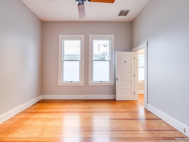 302 Cedar, San Antonio, TX 78210 - spare room featuring ceiling fan, light wood finished floors, and baseboards
