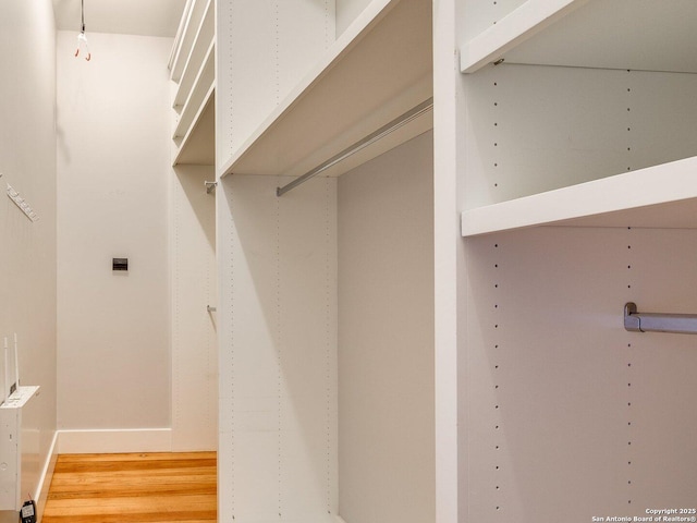 302 Cedar, San Antonio, TX 78210 - spacious closet featuring wood finished floors