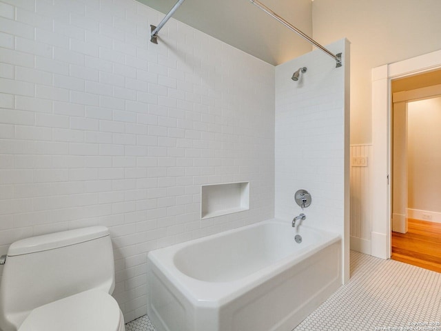 302 Cedar, San Antonio, TX 78210 - full bath with toilet, washtub / shower combination, tile patterned flooring, and tile walls