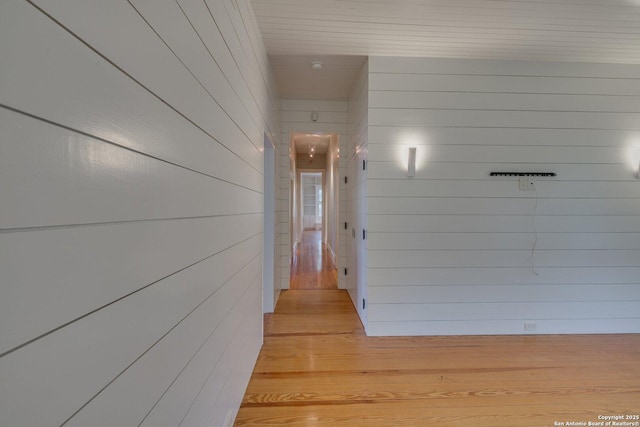 302 Cedar, San Antonio, TX 78210 - hallway with wood walls and light wood-type flooring