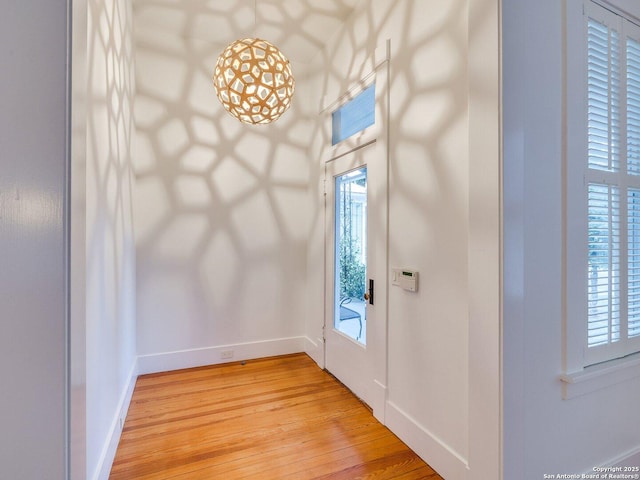 302 Cedar, San Antonio, TX 78210 - entryway with light wood-style flooring, baseboards, and plenty of natural light